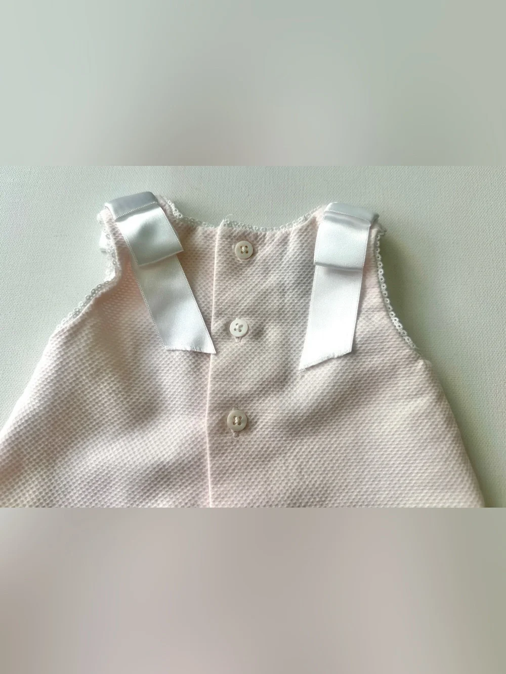 Dulces girl’s pique dress is classic Spanish-style heirloom garment.  Size 0-3M.